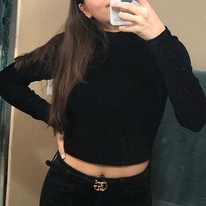 Black textured right fitting longsleeve with open back.